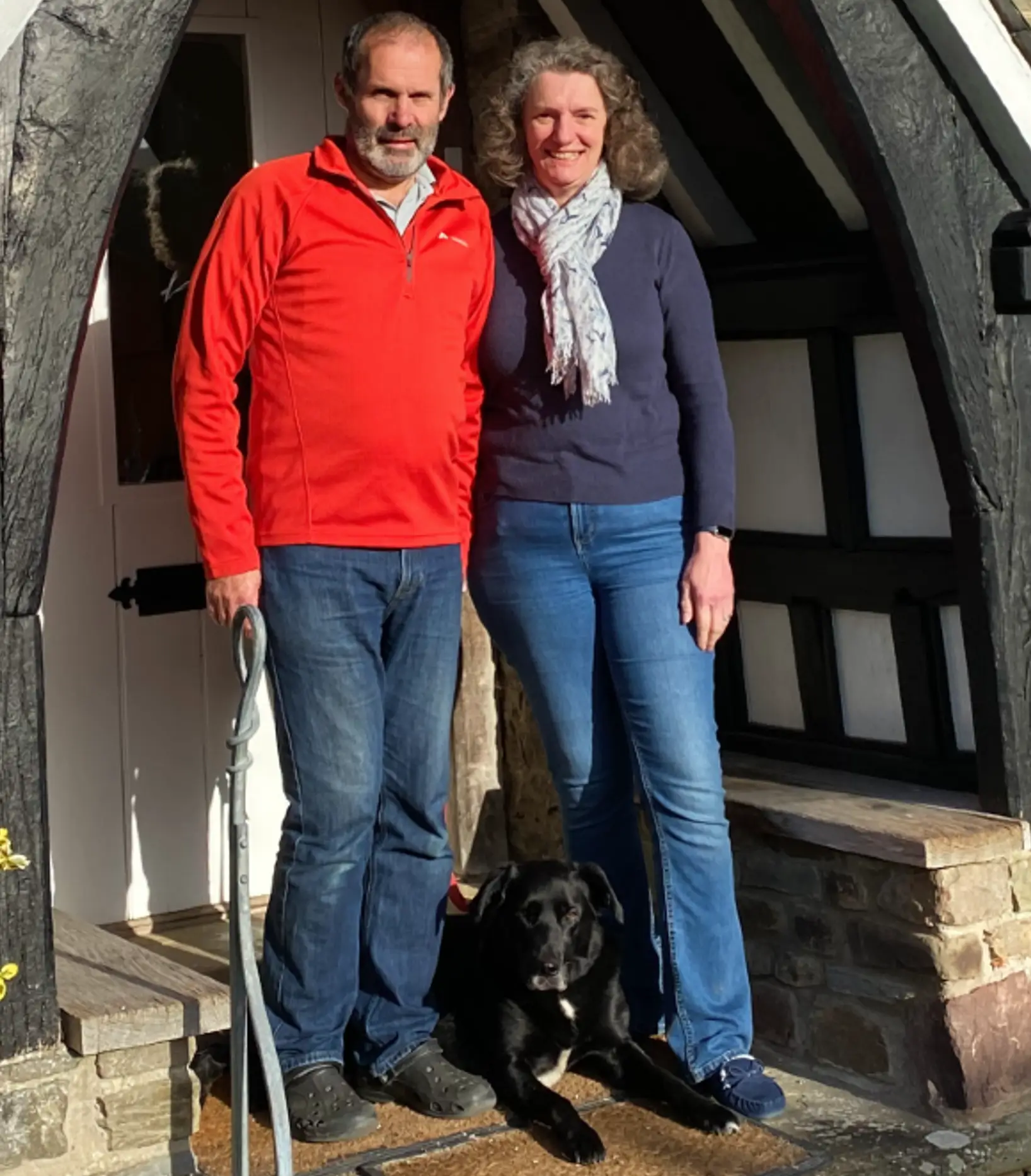 Clare, dave & Molly the dog in the porch of School House